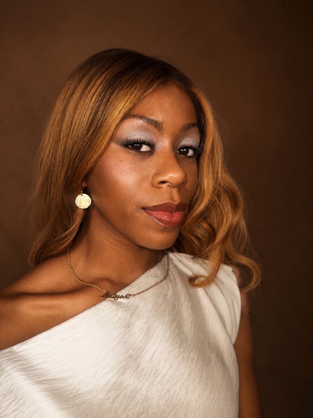 Warm glam with a soft smoky eye and a glossy lip