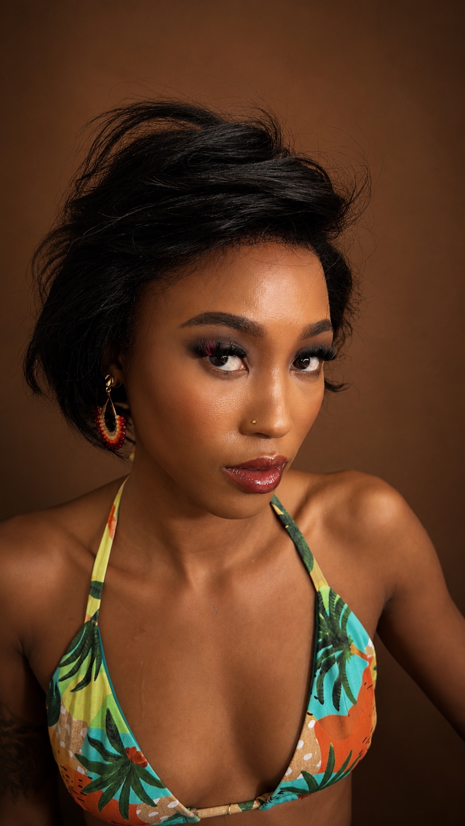 Dramatic evening glam with a defined smoky eye and bold brow